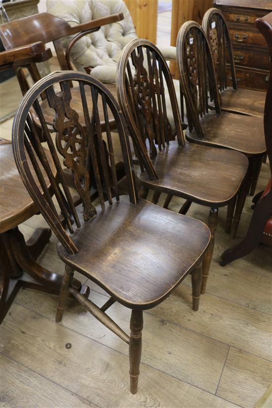 A set of four wheelback chairs